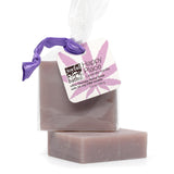 Happy Place  Lavender Vanilla Hemp Soap with a purple hairtie on a white background