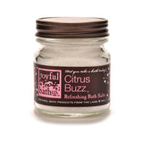 Citrus Buzz Refreshing Bath Salts in a small glass jar