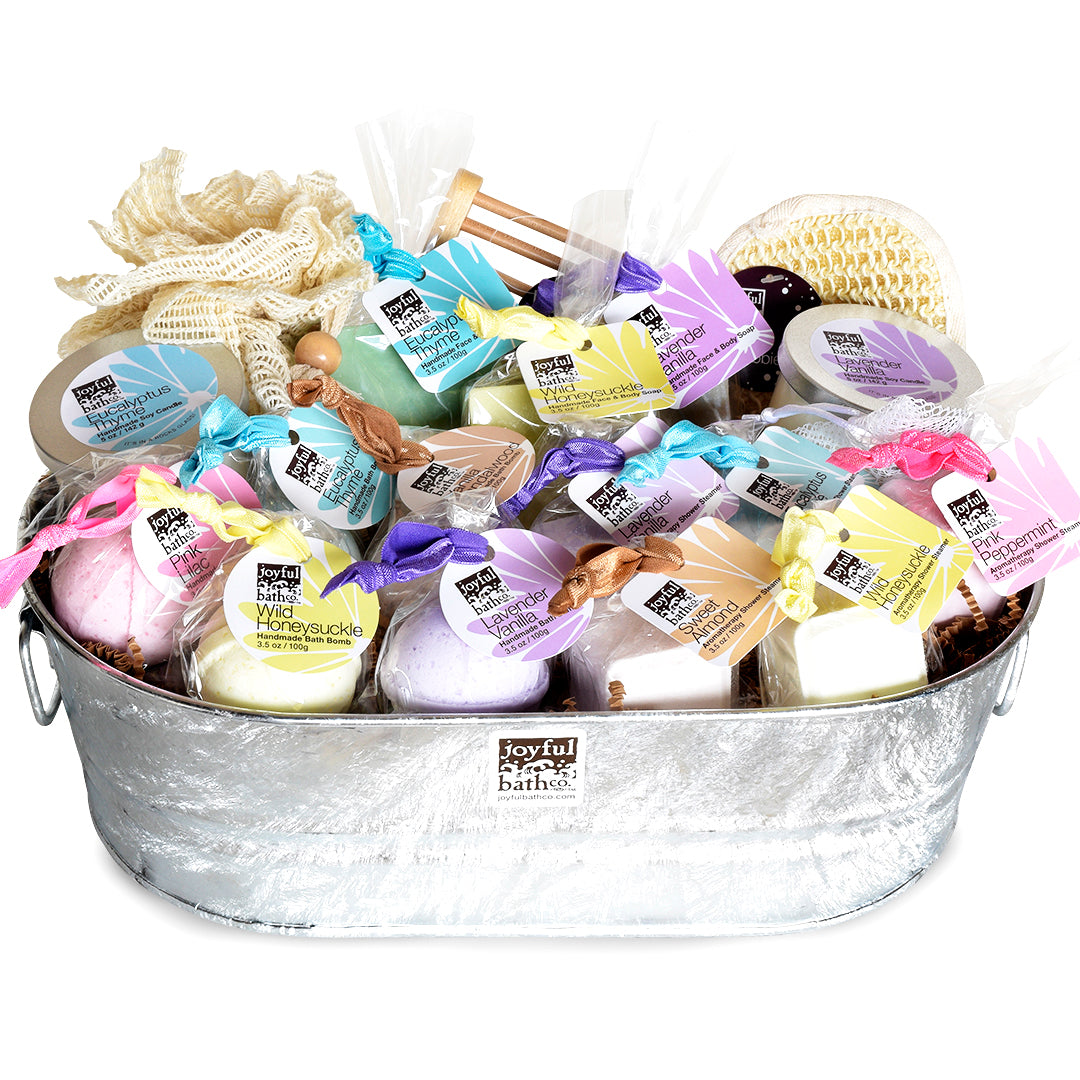 Pure Bliss Gift Set filled with bath bombs, shower steamers, a couple of candles and bath accessories