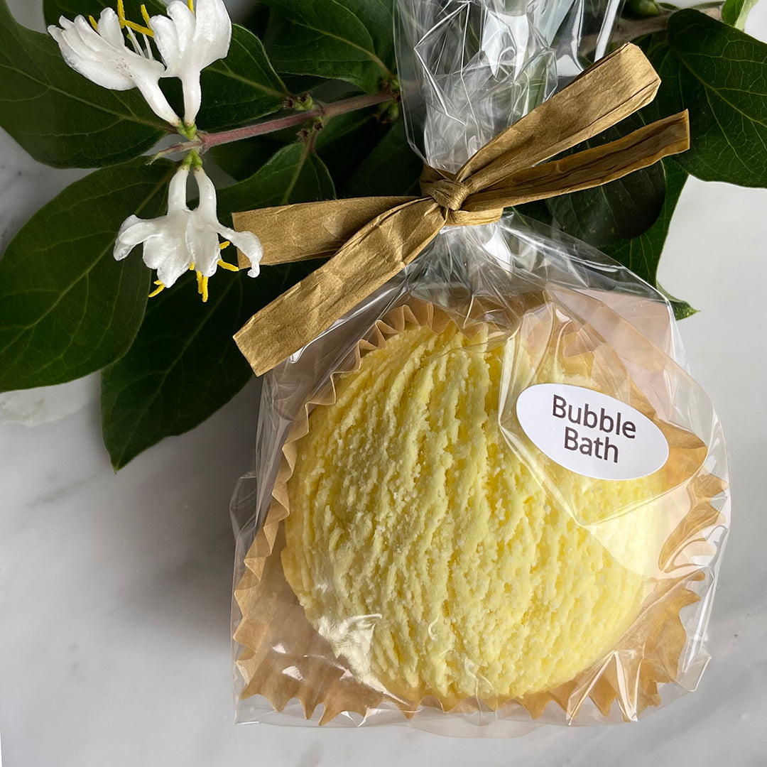 Wild Honeysuckle Bubble Bath Scoop inside bag and tied with a bow surrounded by honeysuckle flowers