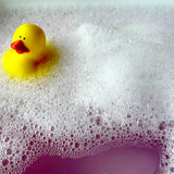 Duck floating in Bubble Bath 